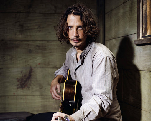 In this July 29, 2015 file photo, Chris Cornell plays guitar during a portrait session at The Paramount Ranch in Agoura Hills, Calif. Cornell, 52, who gained fame as the lead singer of the bands Soundgarden and Audioslave, died at a hotel in Detroit and police said Thursday, May 18, 2017, that his death is being investigated as a possible suicide. (Photo by Casey Curry/Invision/AP, File)