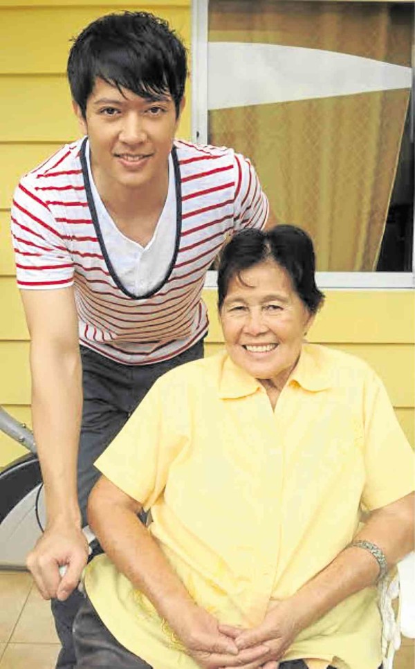 Ronnie Liang (left) and mom Adelina in  their home in Angeles City, Pampanga—ARNOLD ALMACEN