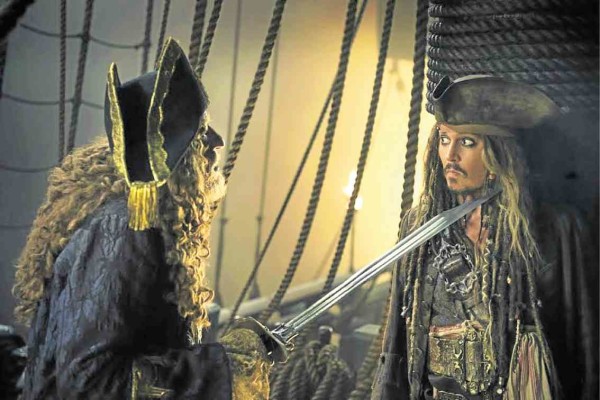 Geoffrey Rush (left) and Johnny Depp in “Pirates of the Caribbean: Salazar’s Revenge” 