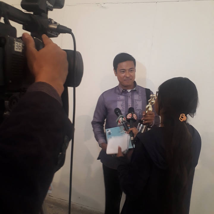 TV reporter interviews Allen Dizon in Bangladesh. Photo courtesy of Dennis Evangelista