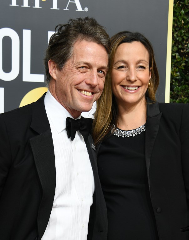 (FILES) In this file photo taken on January 07, 2018 British actor Hugh Grant (L) and Swedish producer Anna Eberstein arrive for the 75th Golden Globe Awards on January 7, 2018, in Beverly Hills, California. Veteran bachelor Hugh Grant, star of a string of romantic comedies including "Four Weddings and a Funeral", is finally getting married for the first time at the age of 57 to his Swedish girlfriend, 39-year-old television producer Anna Eberstein. / AFP PHOTO / VALERIE MACON