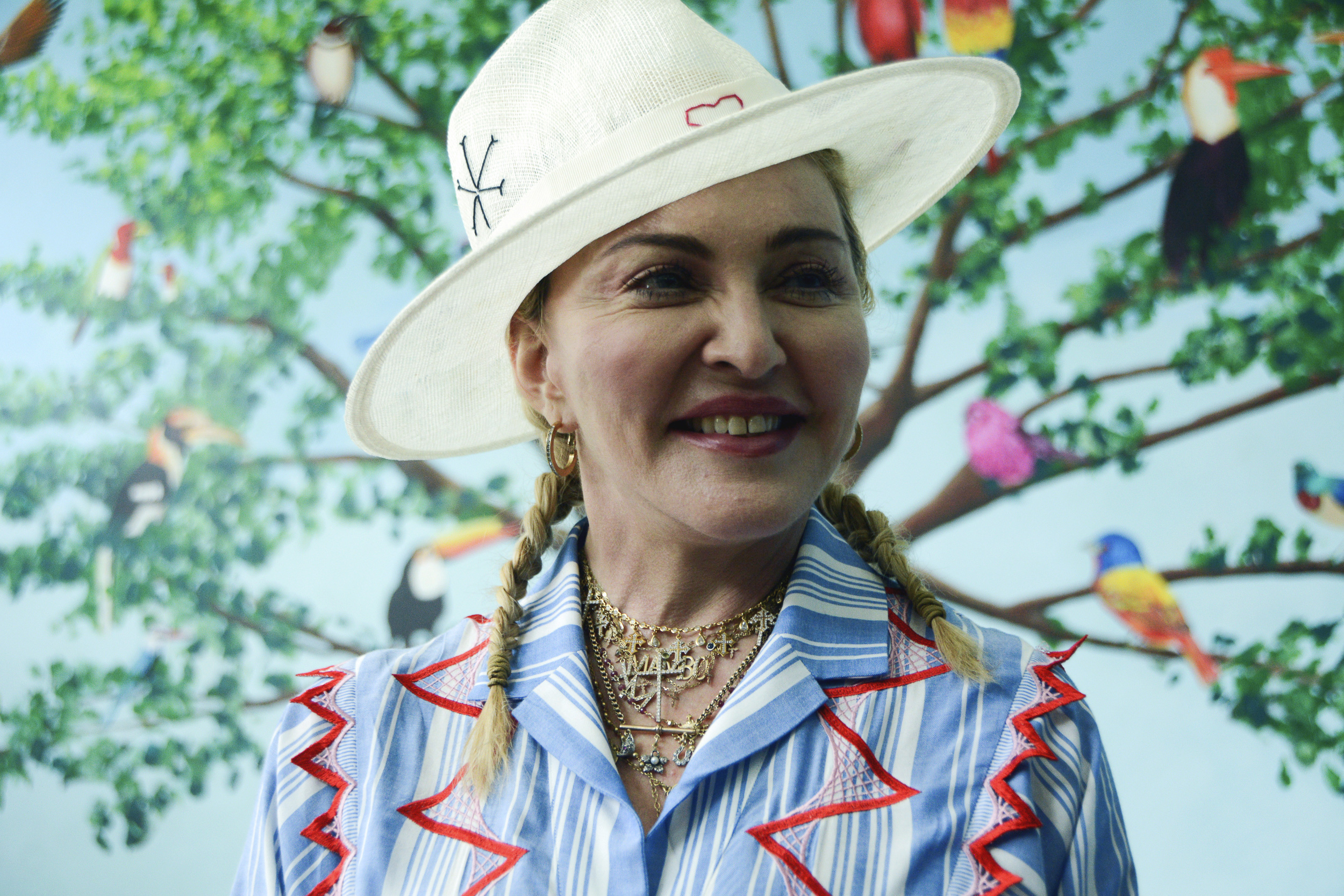 FILE - In this July 16, 2018 file photo, U.S. singer Madonna speaks to the press at a news conference in Blantyre, Malawi. Madonna is celebrating her upcoming 60th birthday with a fundraiser to raise funds for orphans and children in Malawi. The singer tells The Associated Press she’s teaming with Facebook for the fundraiser, which runs from Monday through Aug. 31.  (AP Photo/Thoko Chikondi, File)