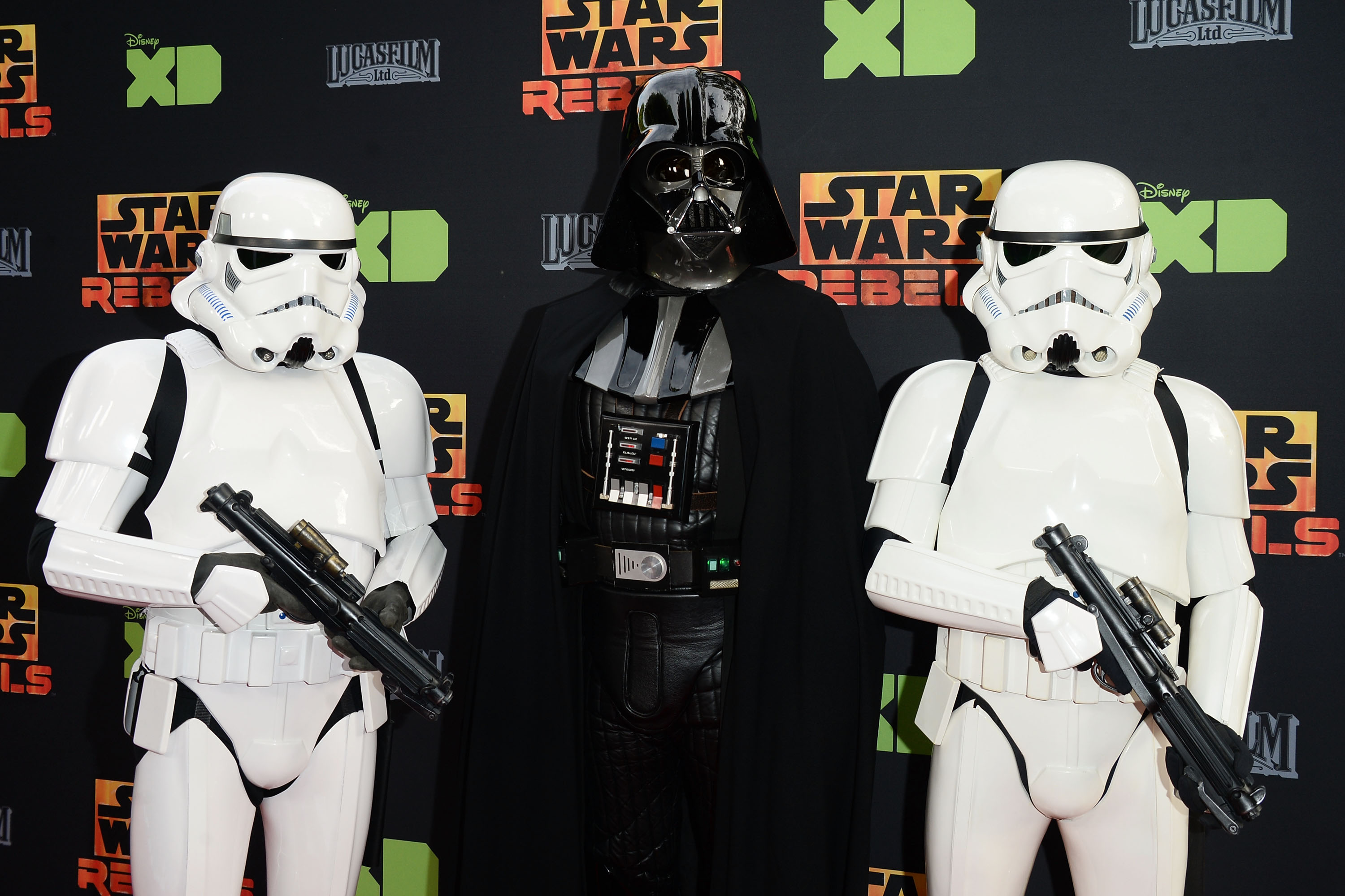 (FILES) In this file photo taken on March 27, 2016 Darth Vader and Stormtroopers arrive at the Disney XD's 'Star Wars Rebels' Season 2 finale event at Walt Disney Studios at Walt Disney Studios in Burbank, California. - The battle is on. Walt Disney Co. is bringing its biggest weapons to a new streaming service, including "Star Wars" and Marvel superheroes, in what is expected to be bruising war with Netflix and others for television dominance. The media-entertainment colossus announced its Disney+ streaming service would launch in November in the United States and gradually expand internationally. (Photo by Matt Winkelmeyer / GETTY IMAGES NORTH AMERICA / AFP)