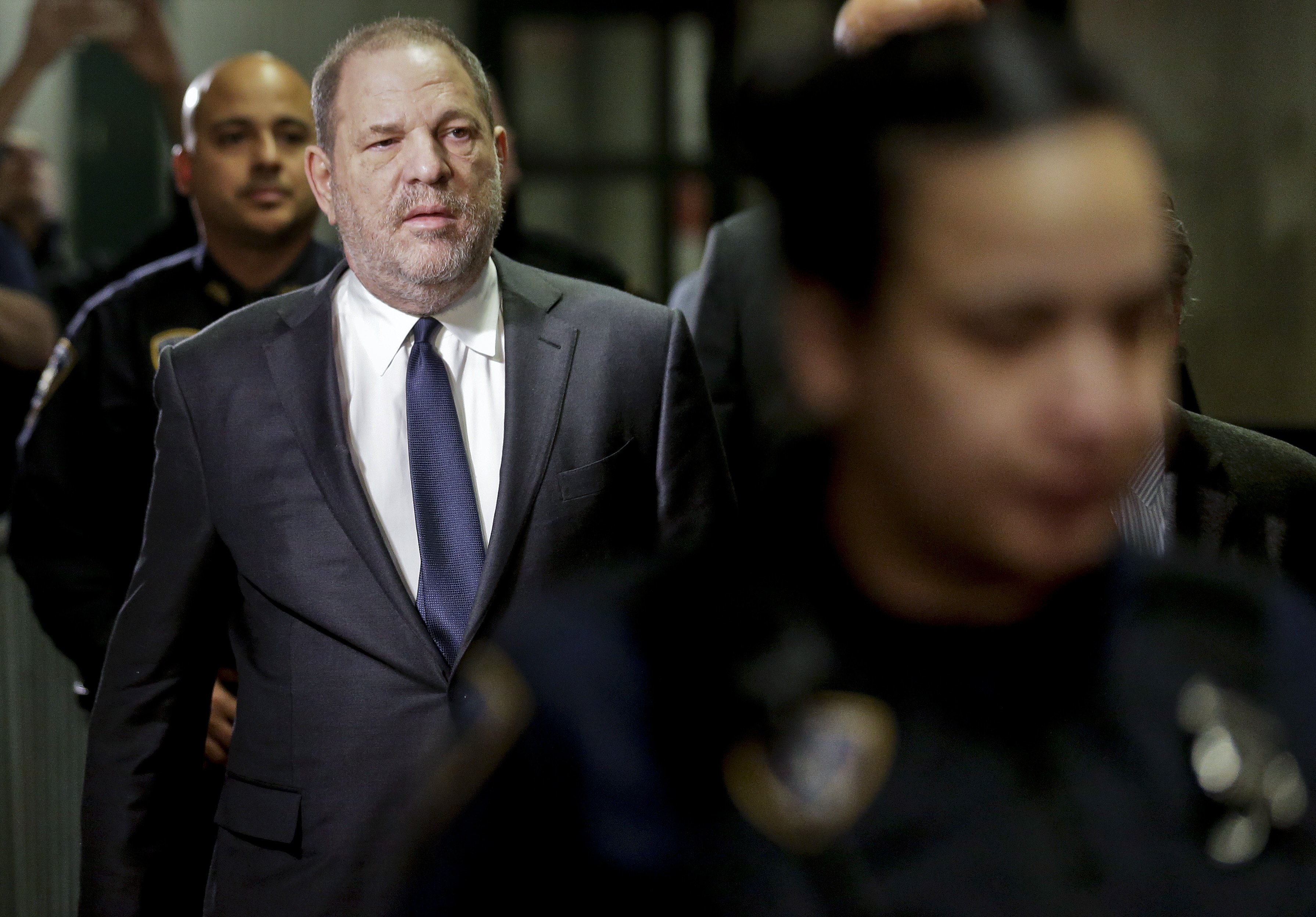 Judge scales back Weinstein suit, allows sex-traffic claim