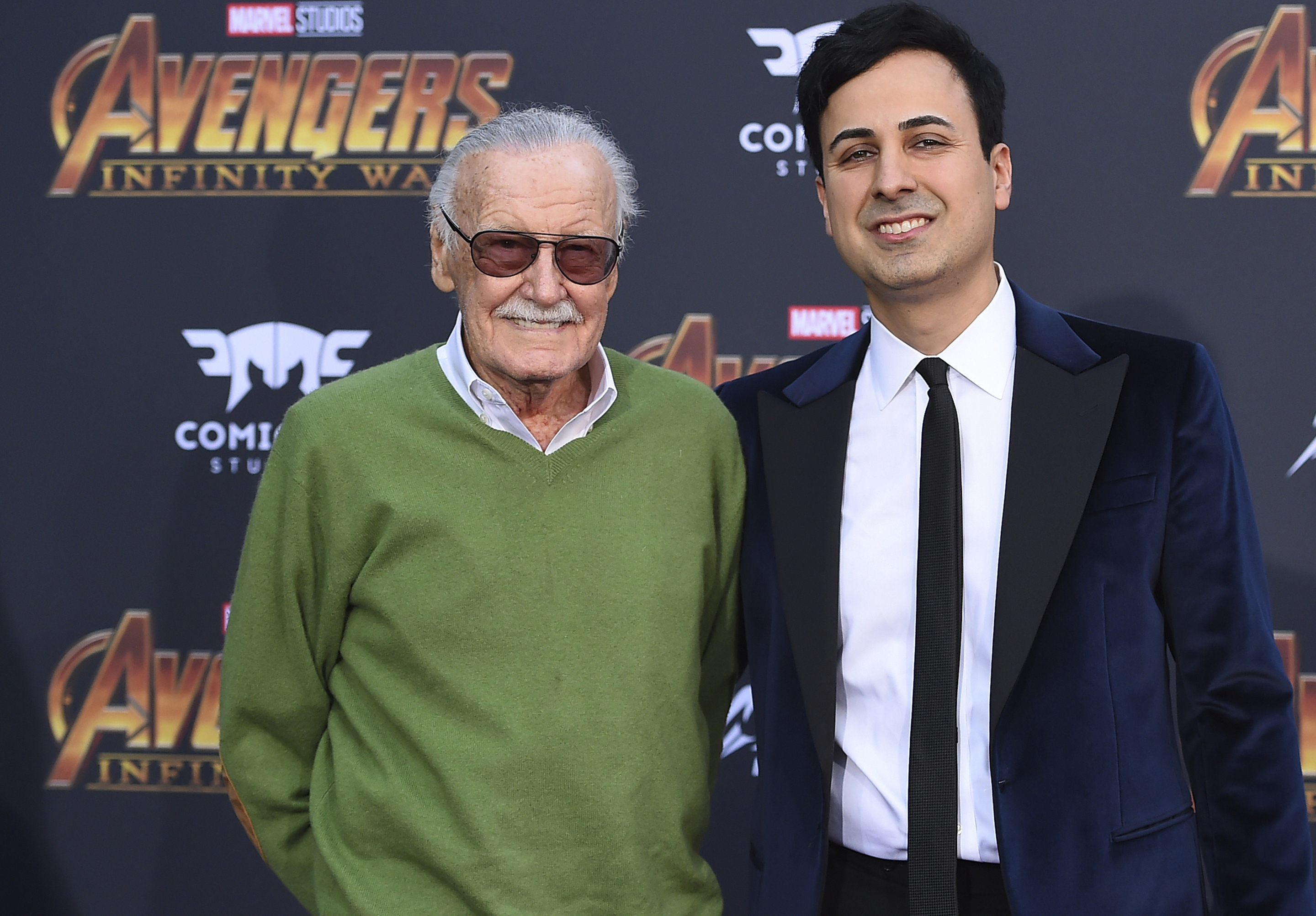 FILE - In this April 23, 2018, file photo, Stan Lee, left, and Keya Morgan arrive at the world premiere of "Avengers: Infinity War" in Los Angeles. Morgan, the former business manager of Lee has been arrested on elder abuse charges involving the late comic book icon. Los Angeles police say  Morgan was taken into custody in Arizona early Saturday, May 25, 2019, on an outstanding arrest warrant. Morgan was charged earlier this month with felony allegations of theft, embezzlement, forgery or fraud against an elder adult, and false imprisonment of an elder adult. (Photo by Jordan Strauss/Invision/AP, File)