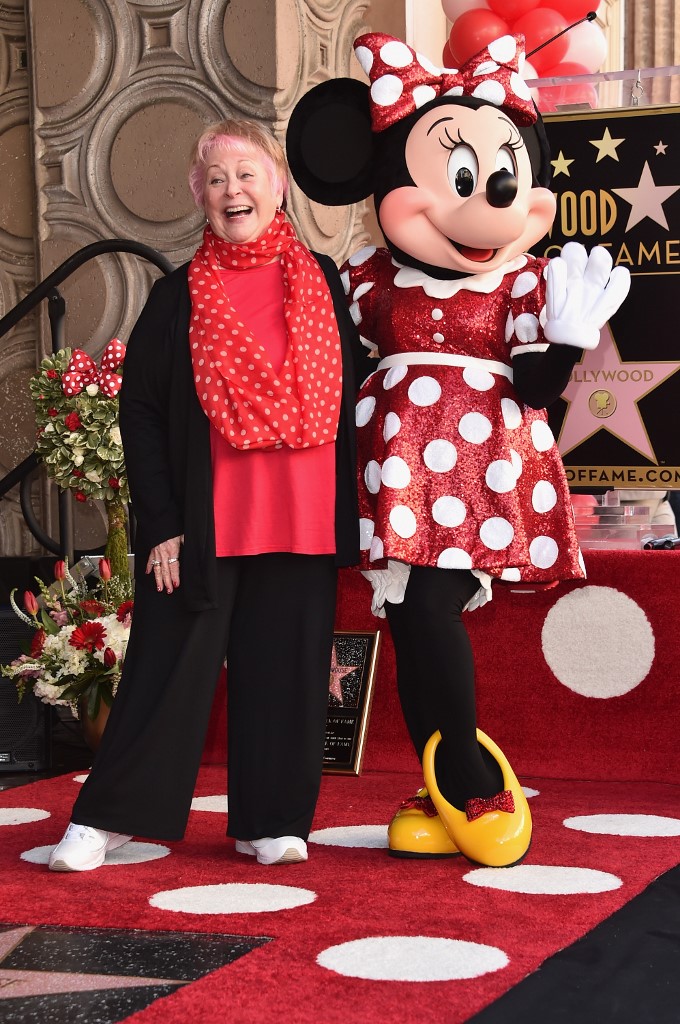 HOLLYWOOD, CA - JANUARY 22: Voice actress Russi Taylor, who has voiced Minnie Mouse since 1986, poses with Minnie Mouse during a star ceremony in celebration of the 90th anniversary of Disney's Minnie Mouse at the Hollywood Walk of Fame on January 22, 2018 in Hollywood, California.   Alberto E. Rodriguez/Getty Images/AFP