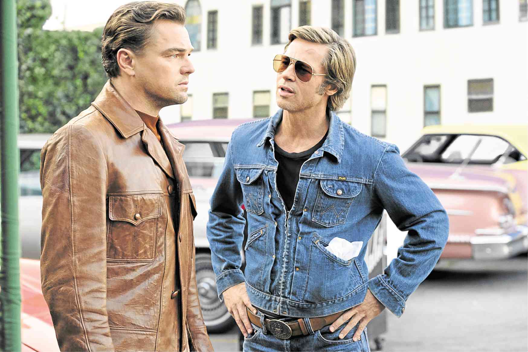 Brad Pitt (right) is Cliff Booth, the stunt double of fading star Rick Dalton (Leonardo DiCaprio) in Quentin Tarantino’s “Once Upon a Time in Hollywood” —SONY PICTURES