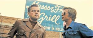 DiCaprio (left), as a fading star, is consoled by his friend and stunt double (Brad Pitt) in “Once Upon a Time in Hollywood.” —SONY PICTURES
