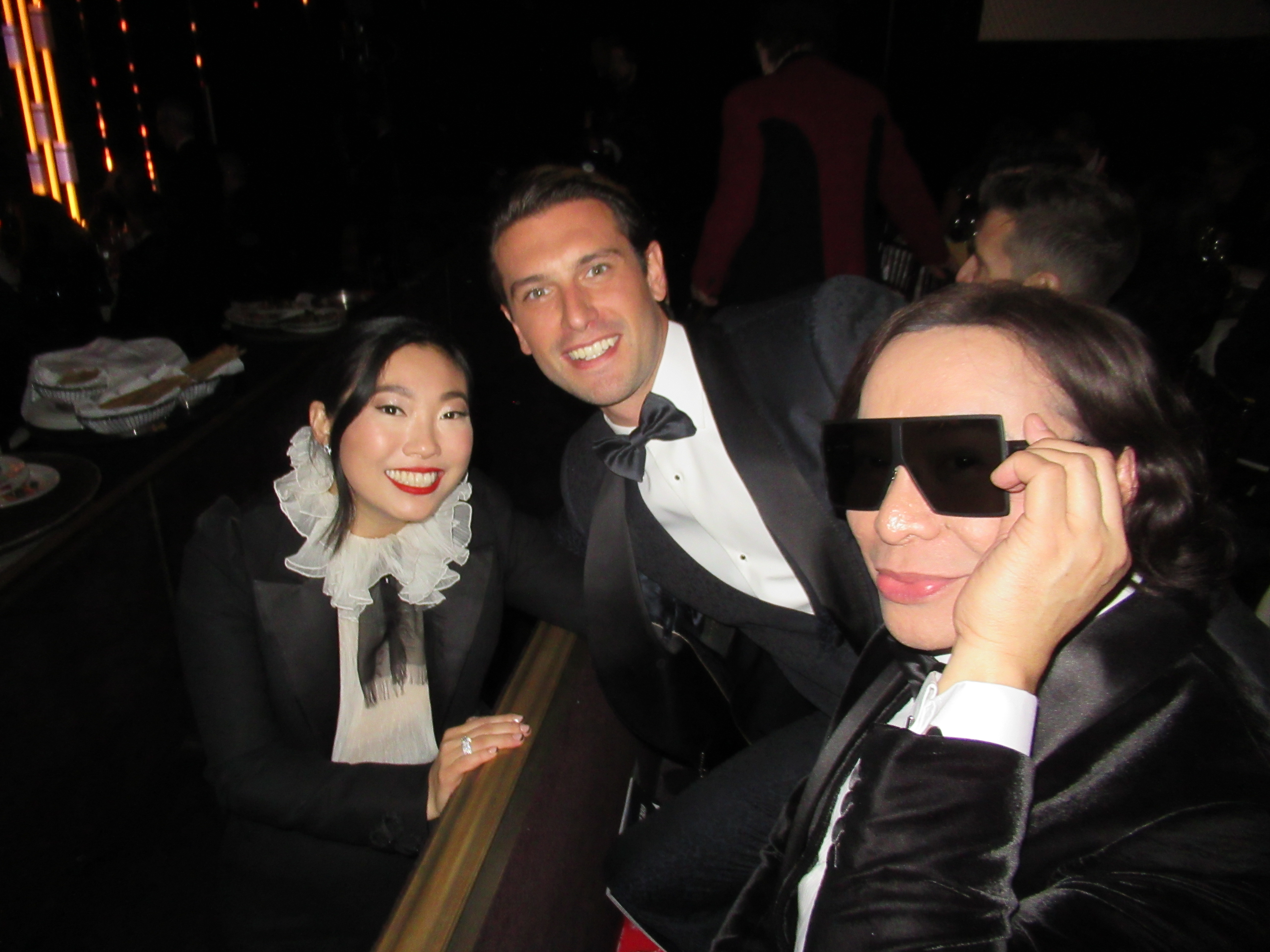From left: Awkwafina, just minutes before her historic win, with Marcelo Olguin and Michael Cinco