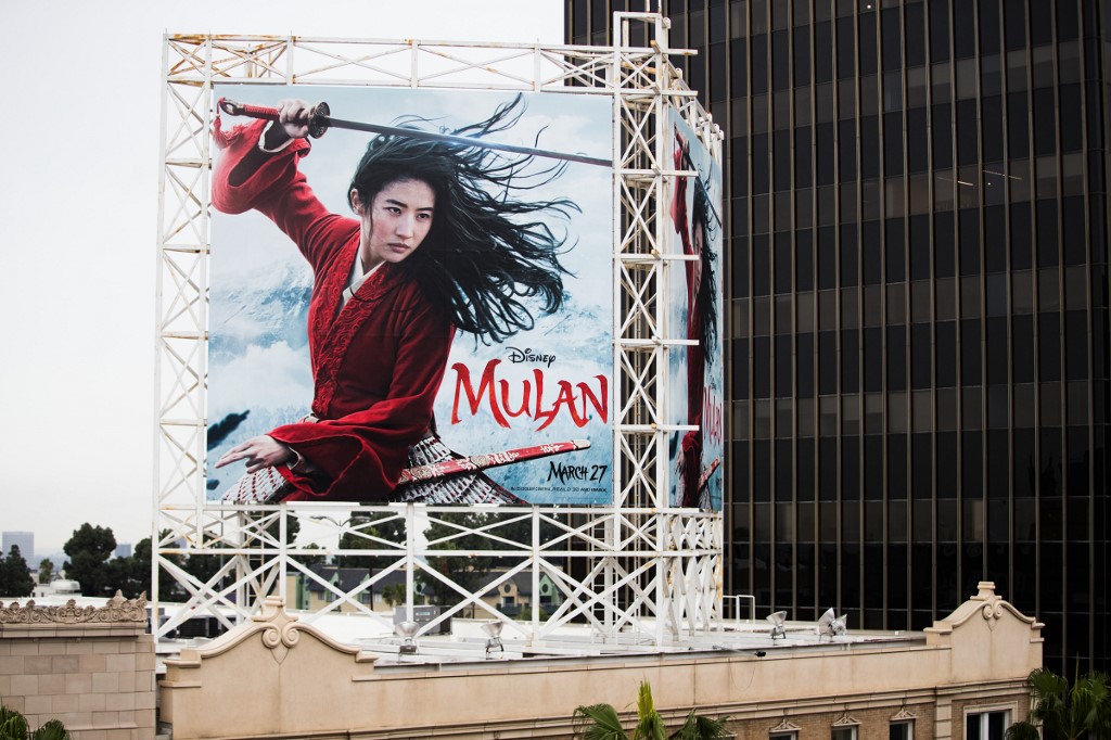 HOLLYWOOD, CALIFORNIA - MARCH 13: An outdoor ad for Disney's "Mulan" is seen on March 13, 2020 in Hollywood, California. The spread of COVID-19 has negatively affected a wide range of industries all across the global economy.   Rich Fury/Getty Images/AFP