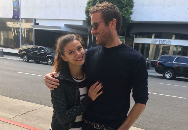 Handout photo shows a woman who identified herself only as Effie stands next to U.S. actor Armie Hammer