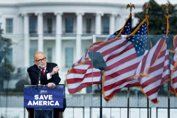 US President Donald Trump's personal lawyer Rudy Giuliani speaks to supporters from The Ellipse near the White House on January 6, 2021, in Washington, DC. - Thousands of Trump supporters, fueled by his spurious claims of voter fraud, are flooding the nation's capital protesting the expected certification of Joe Biden's White House victory by the US Congress
