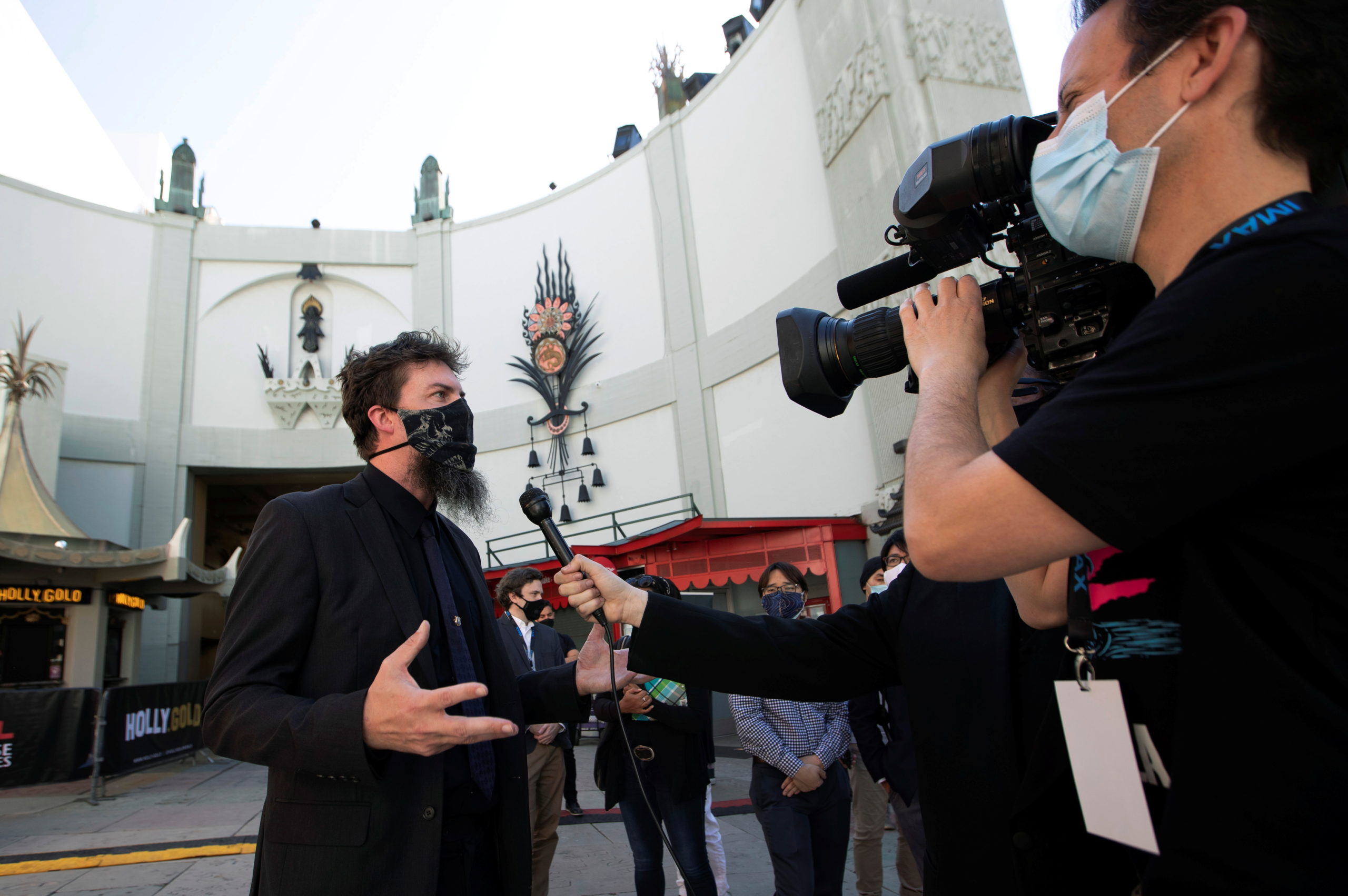 Adam Wingard, director of the upcoming movie "Godzilla vs. Kong", is interviewed at a ribbon cutting ceremony ahead of the reopening of the TCL Chinese theatre during the outbreak of the coronavirus disease (COVID-19), in Los Angeles, California, U.S., March 29, 2021. 