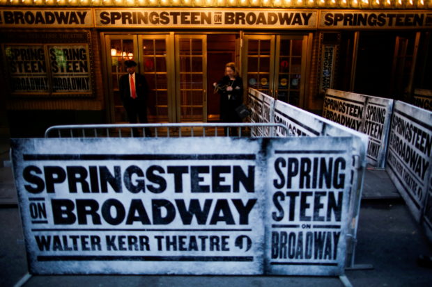 Signs are seen before the debut of "Springsteen on Broadway" at the Walter Kerr Theatre in New York