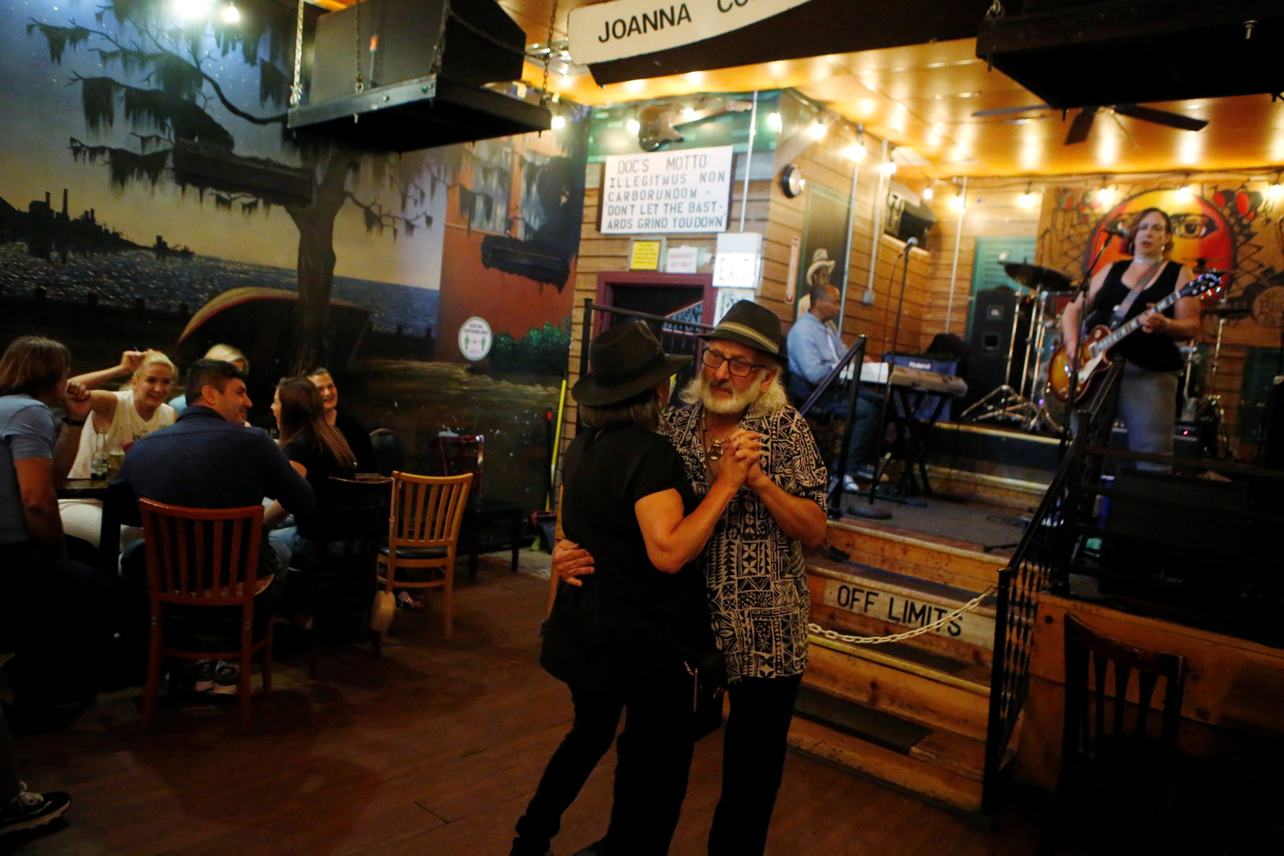 Pamela and Tom Pickens of Madison, Indiana, enjoy live music as coronavirus disease (COVID-19) restrictions are eased at blues bar Kingston Mines in Chicago, Illinois, U.S., June 24, 2021. REUTERS/Eileen T. Meslar