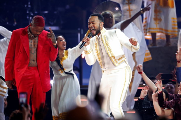 YG performs with John Legend at the 62nd Grammy Awards show in Los Angeles