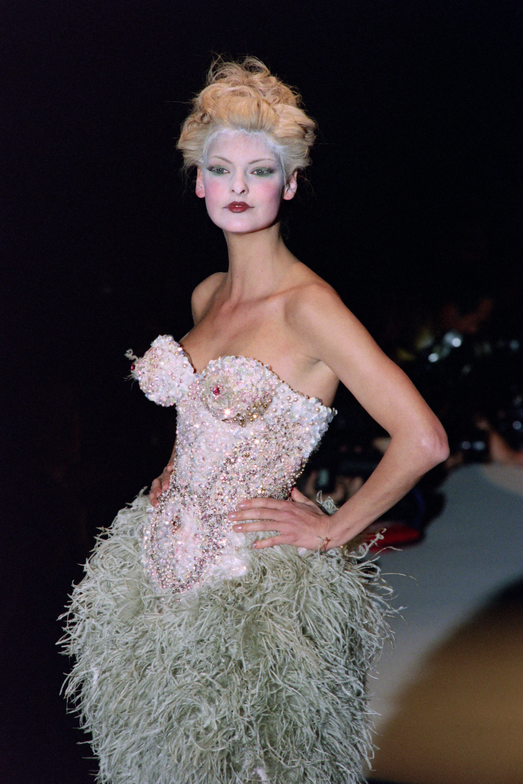 In this file photo taken on March 18, 1995, Canadian model Linda Evangelista displays a creation at the Louvre Carrousel in Paris. - Former supermodel Linda Evangelista says she has been permanently disfigured by a fat-reduction cosmetic procedure that backfired and caused her to look bloated and unrecognizable. Evangelista, 56, said she underwent "CoolSculpting" five years ago and that it had the rare side effect of causing her fat cells to increase rather than decrease.