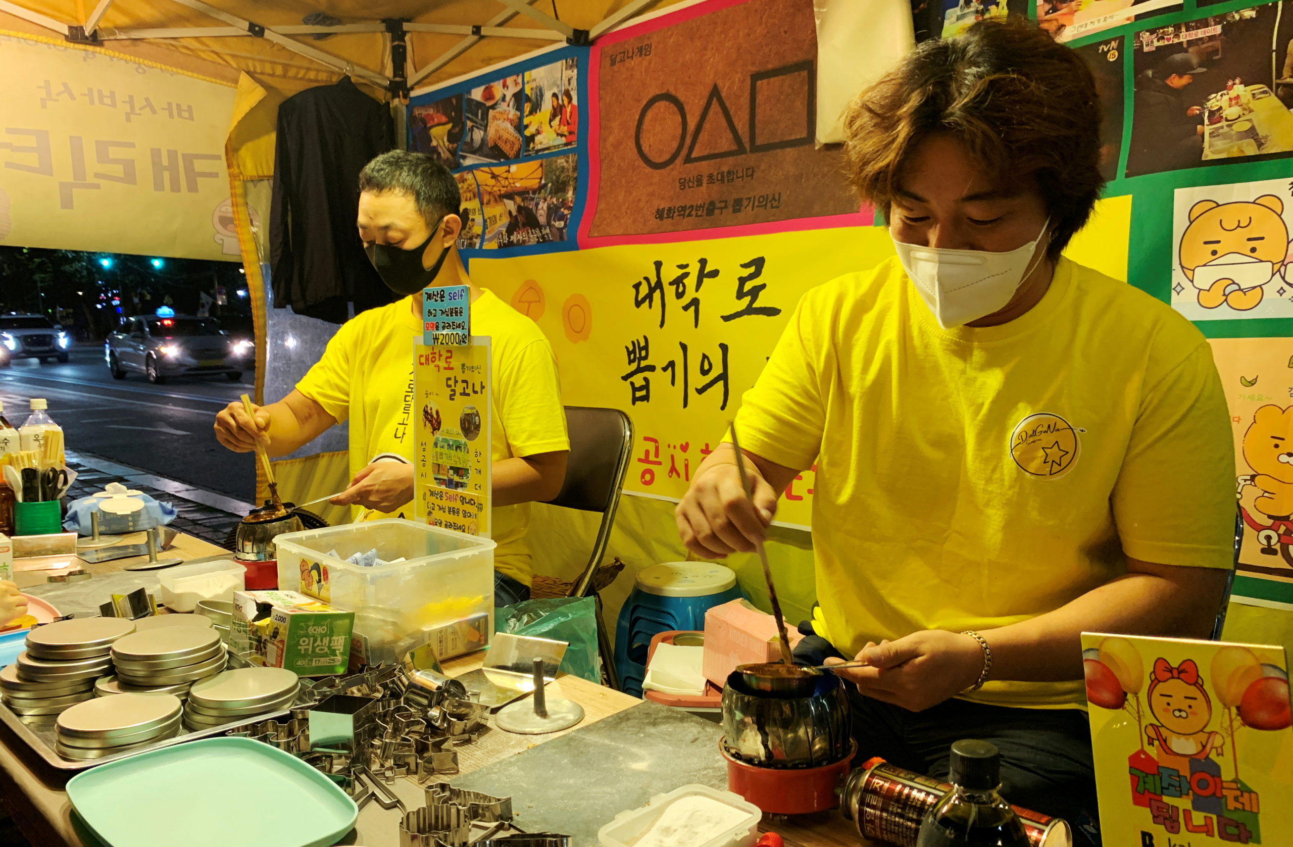 An Yong-hui, Dalgona shop owner, makes a Dalgona candy in Seoul, South Korea, September 30, 2021. REUTERS/Minwoo Park