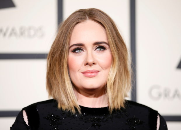 FILE PHOTO: Singer Adele arrives at the 58th Grammy Awards in Los Angeles, California February 15, 2016.    REUTERS/Danny Moloshok