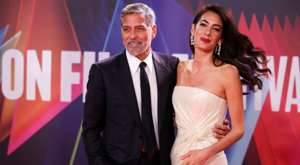 Director George Clooney and his wife lawyer Amal Clooney arrive for a screening of the film "The Tender Bar" as part of the BFI London Film Festival, in London, Britain, October 10, 2021. REUTERS/Henry Nicholls