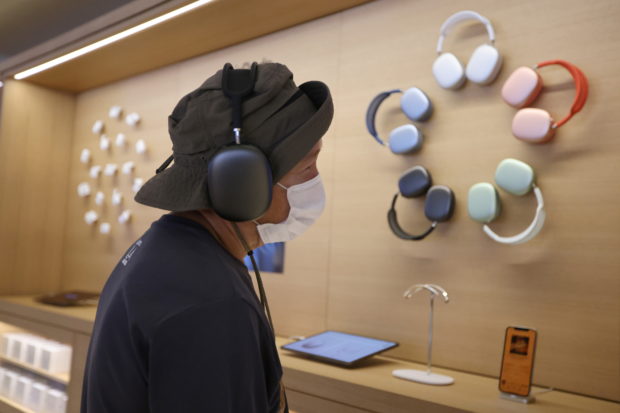 A customer listens to music at the new Apple Store on Broadway in downtown Los Angeles