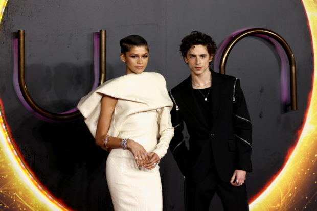 Cast members Zendaya and Timothee Chalamet pose as they arrive for a UK screening of the film "Dune" in London, Britain October 18, 2021. REUTERS/Tom Nicholson