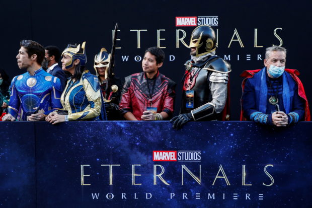 Costumed fans wait ahead of the premiere for the film "Eternals" in Los Angeles, California, U.S.