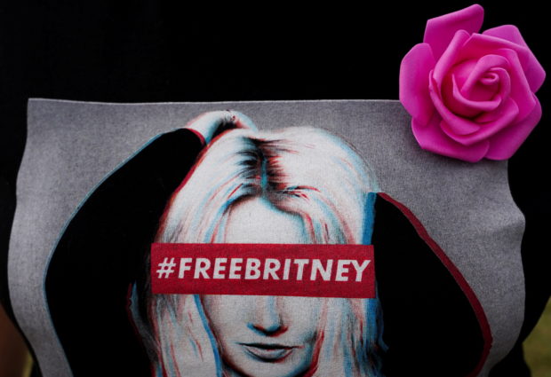 FILE PHOTO: A demonstrator wears a T-Shirt in support of Britney Spears during a "Free Britney" demonstration on the Ellipse, near the White House, in Washington, U.S. October 23, 2021.  REUTERS/Shuran Huang/File Photo
