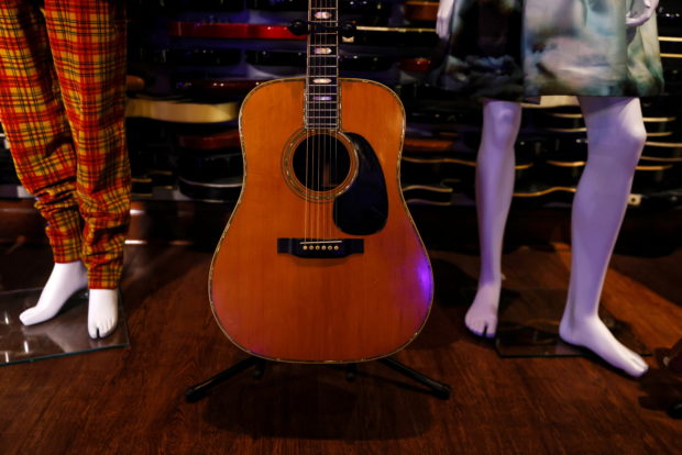 A Martin D-45 acoustic guitar previously owned and played on stage by Eric Clapton at Julien’s auction at Hard Rock Cafe in New York City