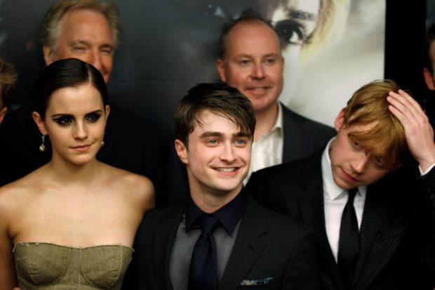 FILE PHOTO: Cast members Rupert Grint (R), Daniel Radcliffe and Emma Watson (L) arrive for the premiere of the film "Harry Potter and the Deathly Hallows: Part 2" in New York July 11, 2011. REUTERS/Lucas Jackson
