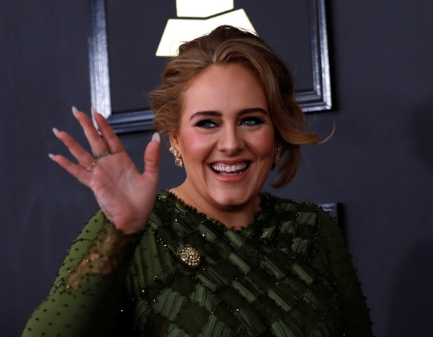 FILE PHOTO: Singer Adele arrives at the 59th Annual Grammy Awards in Los Angeles