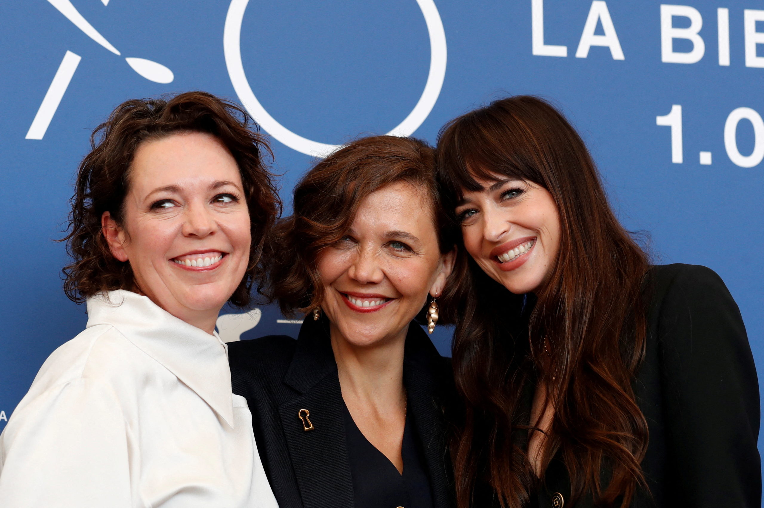 Photo call for "The Lost Daughter" - in competition - Venice, Italy September 3, 2021 - Director Maggie Gyllenhaal and actors Dakota Johnson and Olivia Colman pose. REUTERS/Yara Nardi