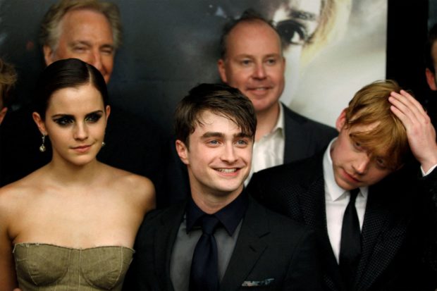 Cast members Rupert Grint (R), Daniel Radcliffe and Emma Watson (L) arrive for the premiere of the film "Harry Potter and the Deathly Hallows: Part 2" in New York July 11, 2011. REUTERS/Lucas Jackson