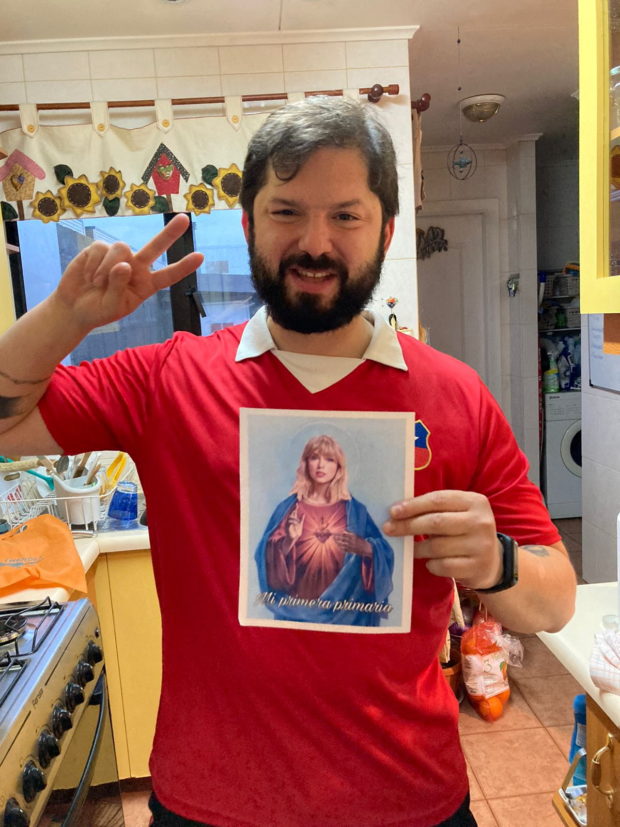 Chile's President-elect Gabriel Boric shows an image of pop star Taylor Swift, in Santiago