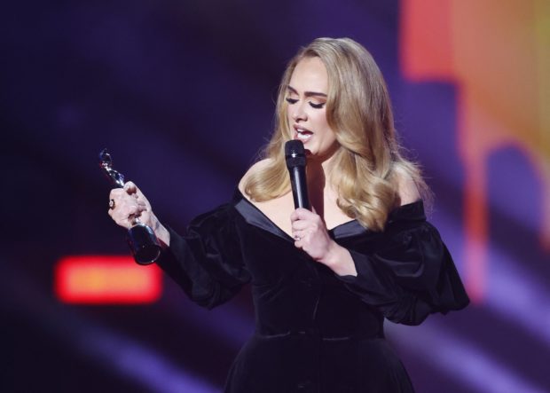 Adele receives the award for Artist of the Year at the Brit Awards at the O2 Arena in London, Britain, February 8, 2022 REUTERS/Peter Cziborra