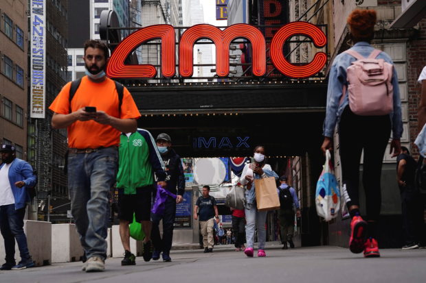 FILE PHOTO: An AMC theatre is pictured in Times Square in the Manhattan borough of New York City, New York, U.S., June 2, 2021. REUTERS/Carlo Allegri