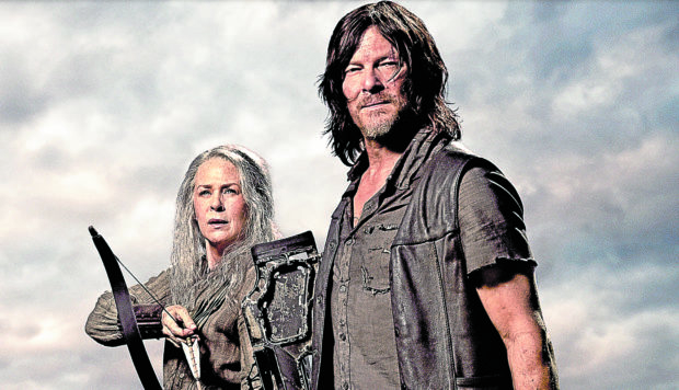 Norman Reedus (right) with Melissa McBride —PHOTO COURTESY OF AMC