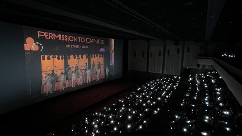 In this photo provided by Hybe, fans watch one of South Korean boy group BTS' three in-person concerts live in Seoul at a Lotte Cinema theater in southern Seoul on Saturday. (Hybe)