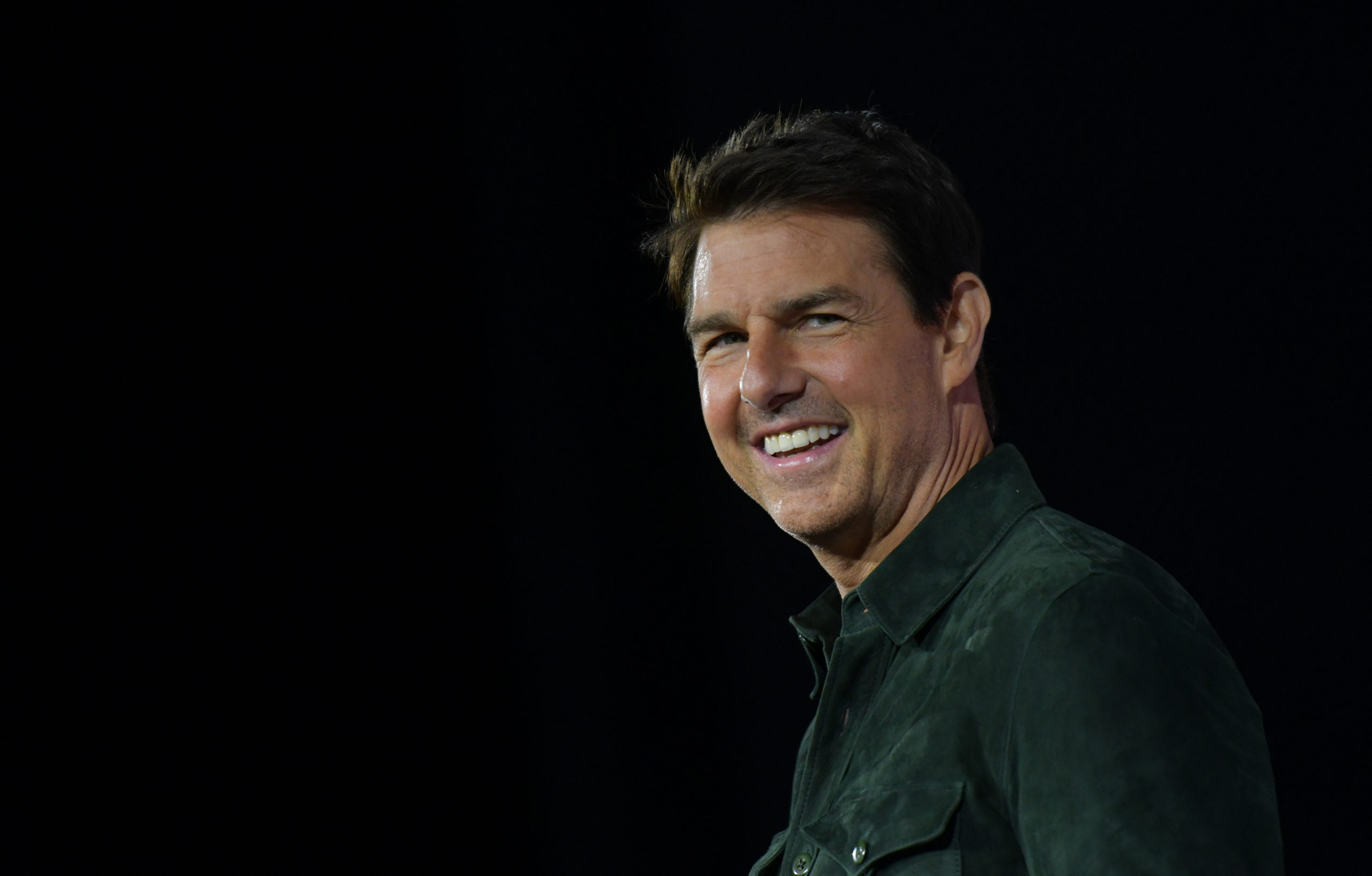 In this file photo taken on July 18, 2019 Actor Tom Cruise makes a surprise appearance in Hall H to promote Top Gun: Maverick  at the Convention Center during Comic Con in San Diego, California. - Tom Cruise unveiled the world-first screening of "Top Gun: Maverick" at CinemaCon in Las Vegas Thursday -- introducing the long-awaited sequel while balanced atop a flying bi-plane. The new "Top Gun," which picks up the story of Maverick and his fighter pilot buddies some three decades after the blockbuster original, was scheduled to open in 2020 but was repeatedly delayed by the Covid-19 pandemic. (Photo by Chris Delmas / AFP)