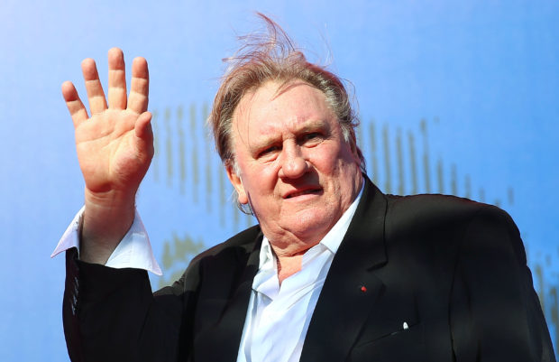 FILE PHOTO: Gerard Depardieu waves as he arrives during a red carpet event for the movie "Novecento- Atto Primo" at the 74th Venice Film Festival in Venice, Italy, Italy September 5, 2017.   REUTERS/Alessandro Bianchi/File Photo