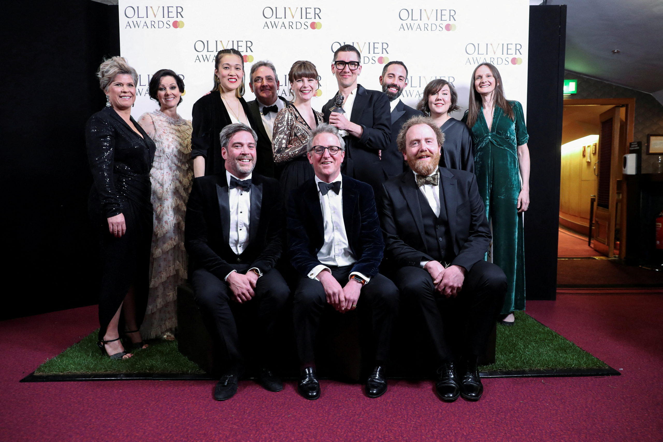 The "Cabaret" crew, winners of the Best Musical Revival award, pose in the winner's room at the Olivier Awards in the Royal Opera House in London, Britain April 10, 2022. REUTERS/May James