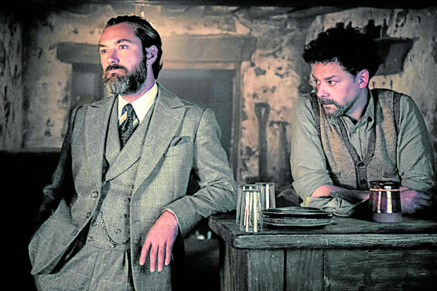 Jude Law (left) and Richard Coyle in “Fantastic Beasts: The Secrets of Dumbledore”