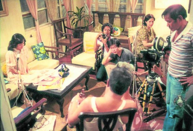 Mike de Leon (center, seated with eyeglasses) giving instructions on the set of “Kisapmata”