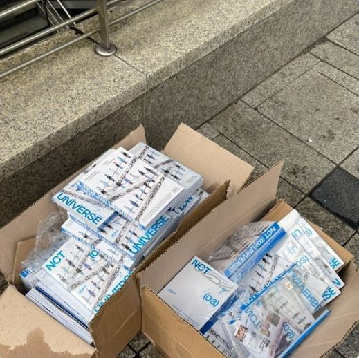 A screen capture image of NCT albums thrown away near Myeongdong Station, seoul