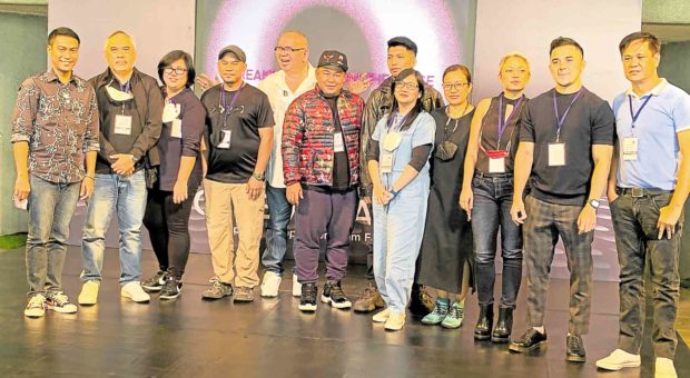 Reyes (fifth from left) with the finalists in the full-length film category: (from left) Carlo Obispo, Milo and Cynthia Paz, TM Malones, Roman Perez Jr., Christian Paolo Lat, Ma-an Asuncion-Dagñalan, Sheenly Gener, Anna Isabelle Matutina, Real Florido and Ronald Batallones.