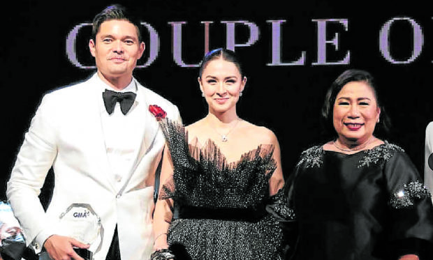 Lilibeth G.  Rasonable  (right) with  “Couple of the  Night” Dingdong Dantes  and Marian Rivera