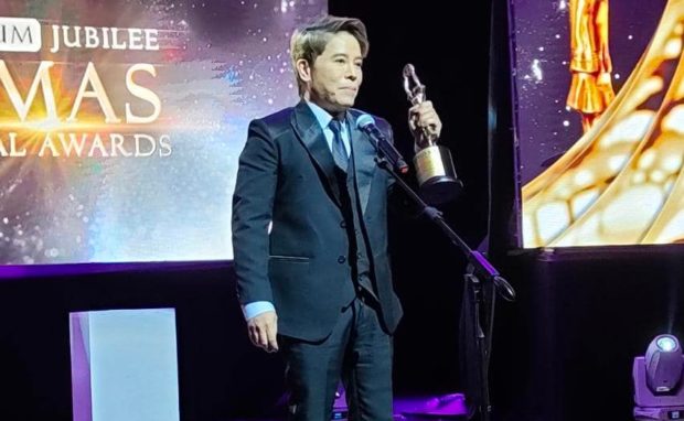 Vincent Tañada at the Famas Awards on July 30 receives one of the seven trophies bagged by his film musical “Katips: Ang Mga Bagong Katipunero,” which also won for him the best director and best actor honors. STORY: ‘Katips’ director hopes Famas buzz spells big audience