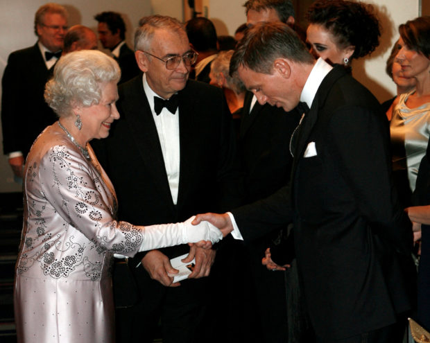 FILE PHOTO: Britain's Queen Elizabeth (L) meets actor Daniel Craig during the world premiere of the latest James Bond movie "Casino Royale" at the Odeon cinema in Leicester Square in London November 14, 2006. REUTERS/Stephen Hird/File Photo