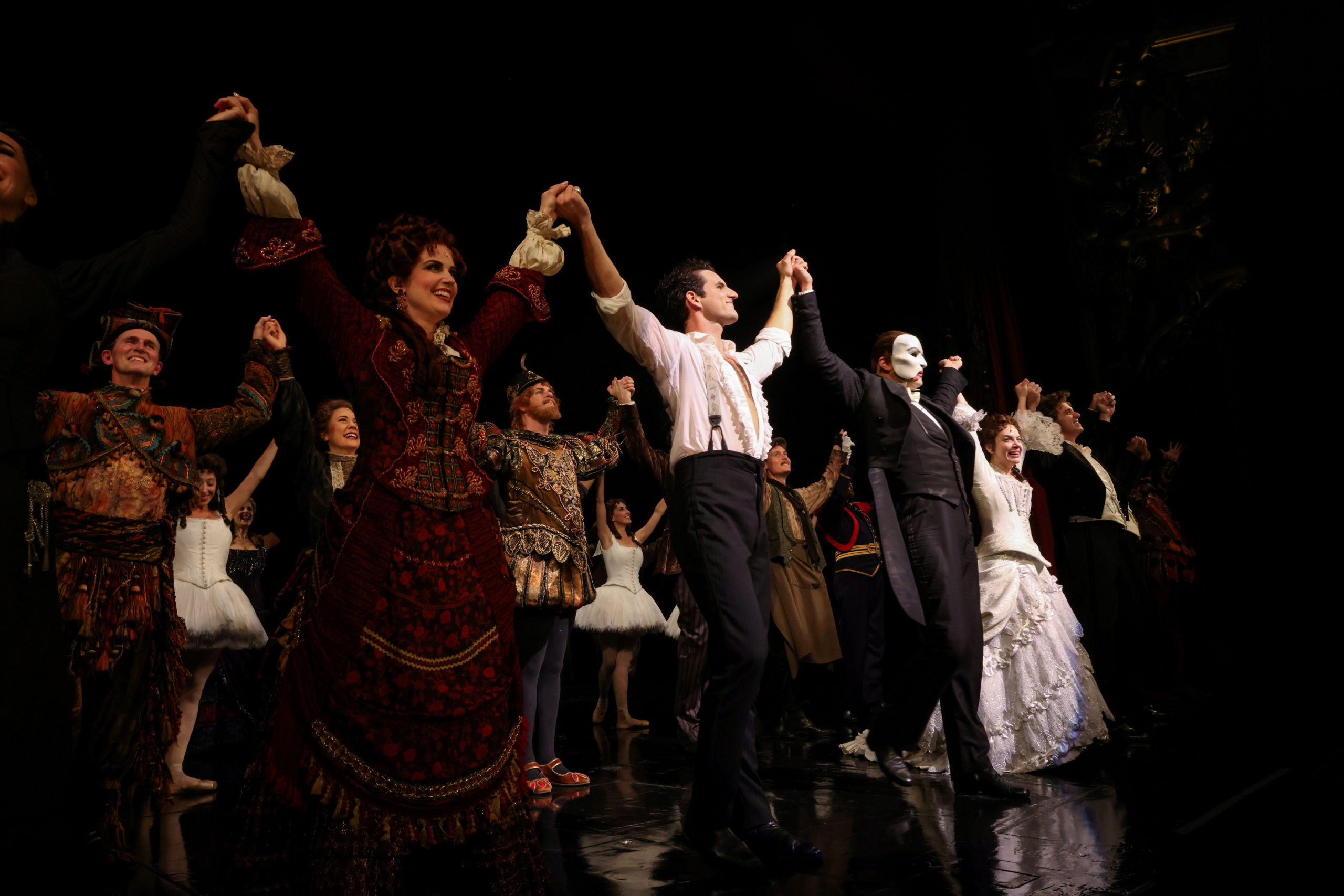 Cast members stand on the stage after performing on the re-opening night of "Phantom of the Opera" at the Majestic Theater in New York City, New York, U.S., October 22, 2021. Picture taken October 22, 2021. REUTERS/Caitlin Ochs