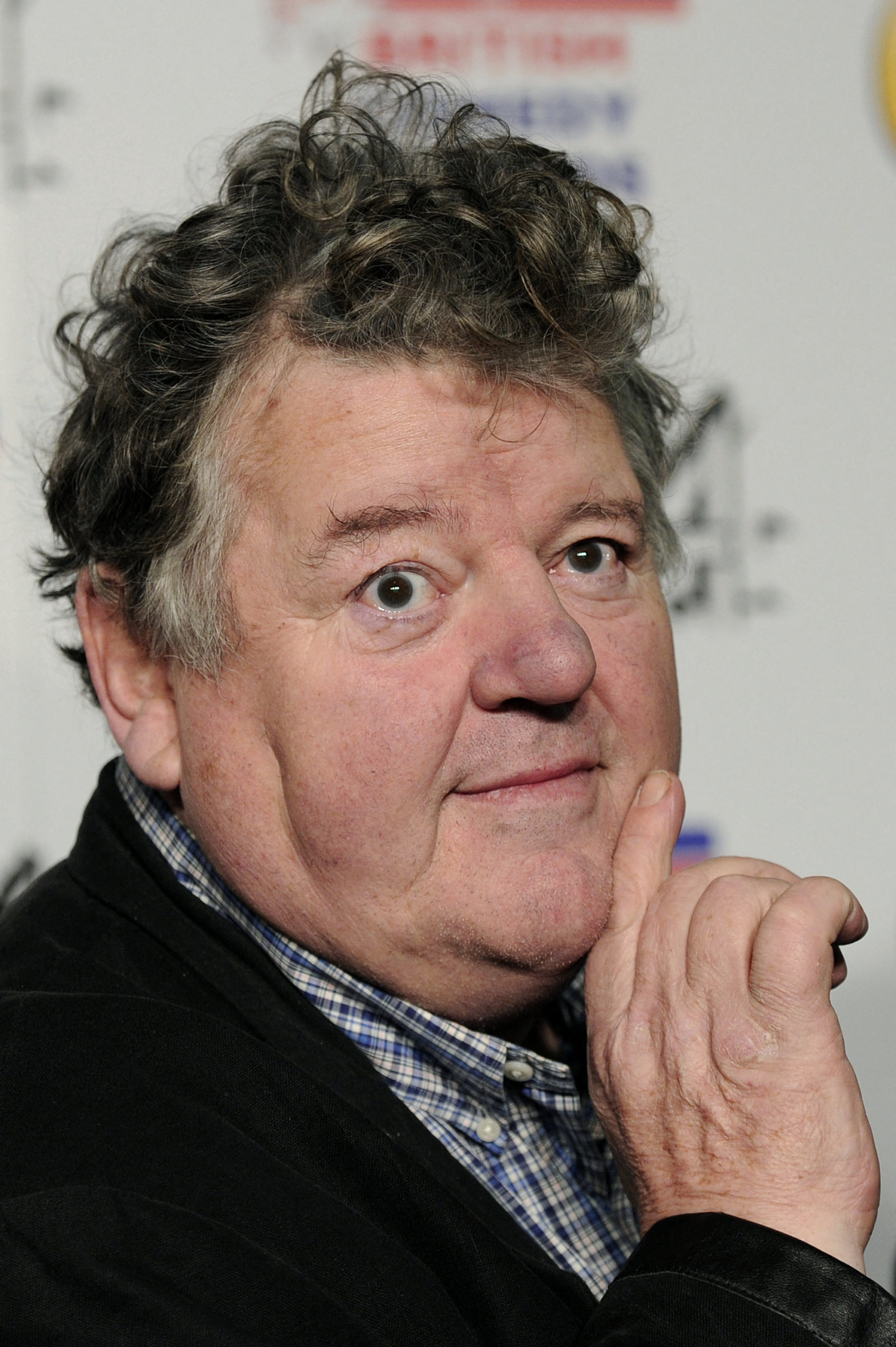 (FILES) In this file photo taken on December 16, 2011 British actor and comedian Robbie Coltrane attends the British Comedy Awards in London. - Scottish actor Robbie Coltrane, who played Hagrid in the Harry Potter films, has died aged 72, his agent said on Friday, October 14. (Photo by CARL COURT / AFP)